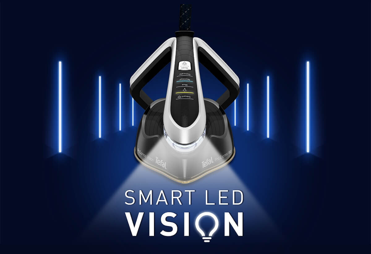 Na obrazie widoczny jest generator pary z logo Tefal, emitujący światło LED. Poniżej znajduje się napis \'SMART LED VISION\'.