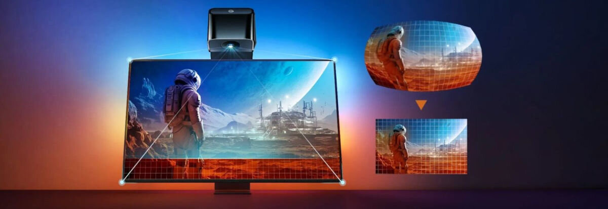 Obraz przedstawia ekran telewizora z wyświetlonym krajobrazem kosmicznym, na którym widoczny jest astronauta. Nad ekranem znajduje się urządzenie, a wokół telewizora widać kolorowe podświetlenie LED.