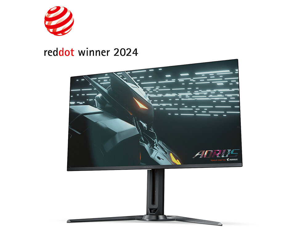 Monitor z wyświetlaczem przedstawiającym futurystyczną grafikę, z logo \'AORUS\' w prawym dolnym rogu ekranu. Nad monitorem znajduje się napis \'reddot winner 2024\' z czerwonym logo.