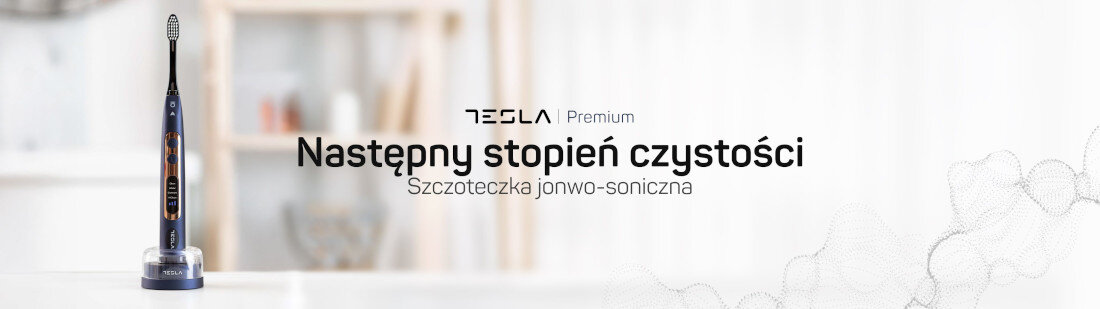 Na obrazie widoczna jest granatowa szczoteczka soniczna stojąca na podstawce. Obok znajduje się tekst: \'TESLA Premium Następny stopień czystości Szczoteczka jonwo-soniczna\'.