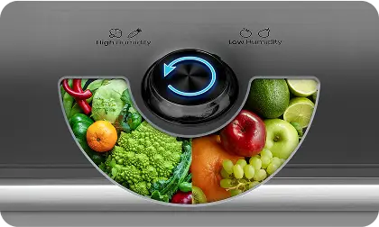 Obrazek przedstawia pokrętło z niebieskim podświetleniem, otoczone ilustracjami warzyw i owoców. Widoczny tekst to \'High Humidity\' i \'Low Humidity\'.