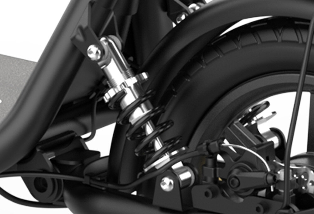 Zbliżenie na mechanizm zawieszenia i tylne koło czarnego skutera elektrycznego. Widoczne są sprężyny, amortyzator oraz elementy hamulcowe.