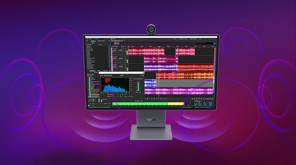 Monitor z wyświetlanym na ekranie oprogramowaniem do edycji dźwięku, z widocznymi falami dźwiękowymi i wykresami. Na podstawie monitora znajduje się logo \'YOGA\'.