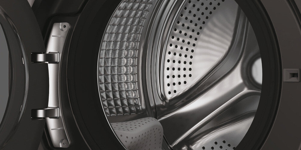 PRALKA HAIER HW100BD14397PGUS X11 lifestyle wizualizacja otwarta wnętrze bęben pusty Wyjątkowa struktura bębna Pillow Drum gładka Powierzchnia struktura ochrona tkanin