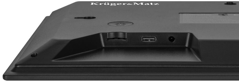 Tył ramki cyfrowej z widocznym logo \'Krüger&Matz\', przyciskiem zasilania oraz portami USB i audio.