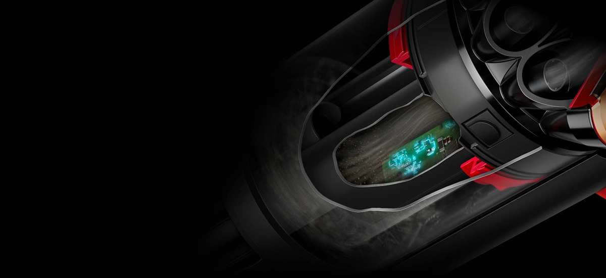 Obraz przedstawia zbliżenie na wnętrze urządzenia z widocznymi elementami mechanicznymi i zielonym światłem. W tle dominuje ciemne tło, które podkreśla szczegóły konstrukcji.