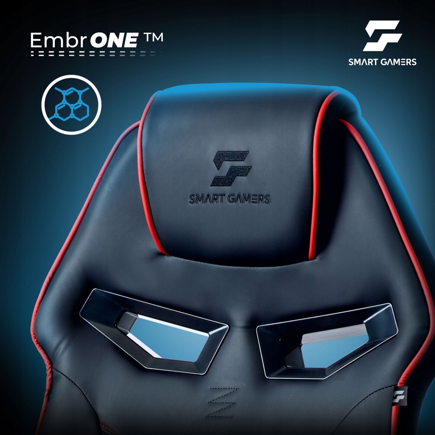 Czarno-czerwony fotel gamingowy z logo \'SMART GAMERS\' na zagłówku. Widoczny napis \'EmbrONE™\' oraz symbol przypominający strukturę molekularną.