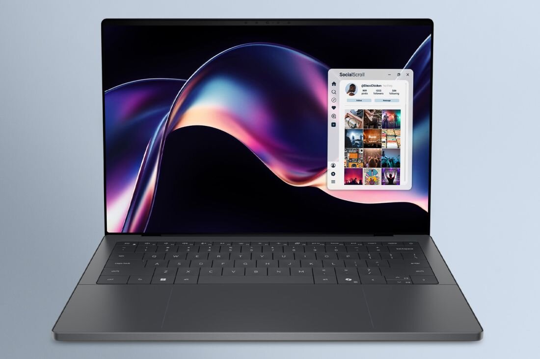 Laptop Dell XPS 14 wyświetla kolorową grafikę i okno aplikacji społecznościowej podczas pracy kreatywnej i wielozadaniowości