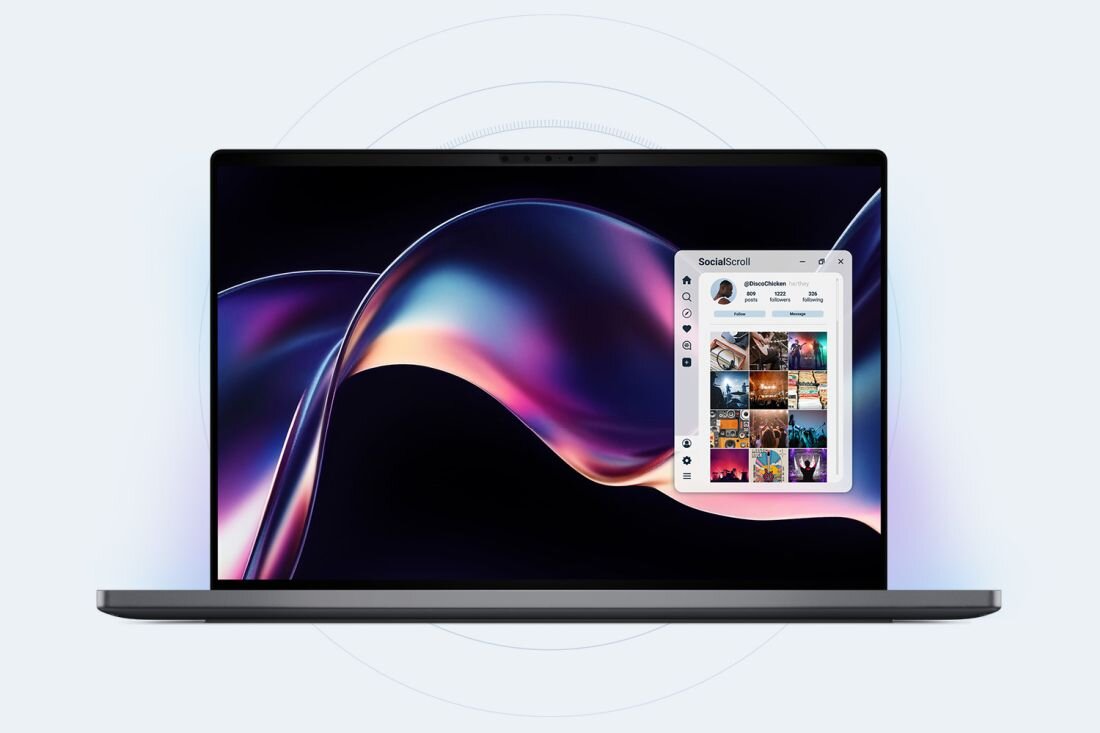 Laptop Dell XPS 14 z ekranem OLED wyświetla aplikację społecznościową podczas pracy kreatywnej i wielozadaniowości