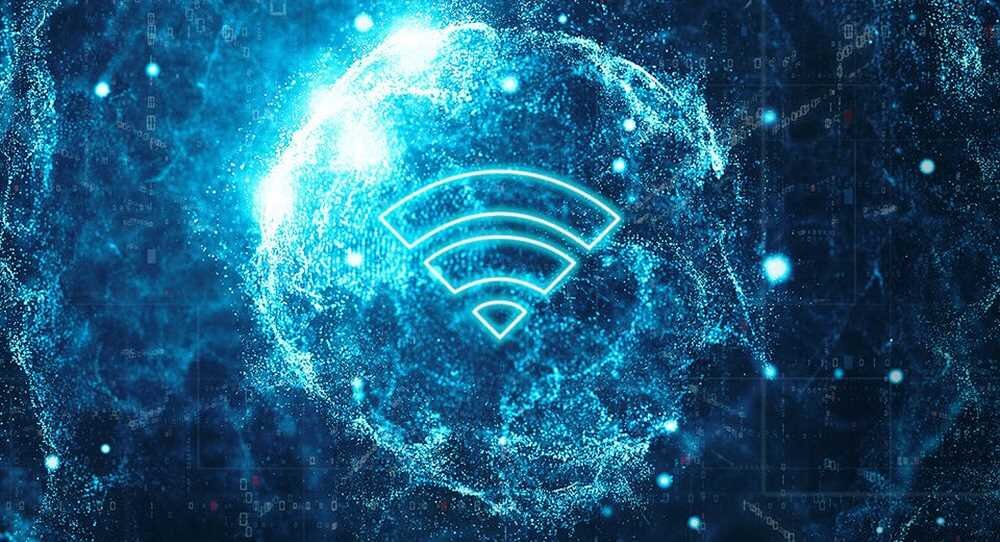 Obraz przedstawia niebieską, abstrakcyjną grafikę z symbolem Wi-Fi na środku. W tle widoczne są rozmyte, świetliste wzory.