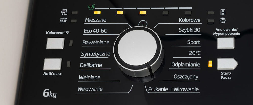 Panel sterowania pralki z centralnym pokrętłem i przyciskami do wyboru programów takich jak Mieszane, Eco 40-60, Bawełniane, Syntetyczne, Delikatne, Wełniane, Wirowanie, Płukanie + Wirowanie, Kolorowe, Szybki 30, Sport, 20°C, Odplamianie, Oszczędny. Widoczne są także przyciski Anulowanie/Wypompowanie, Start/Pauza oraz oznaczenie 6 kg i AntiCrease.