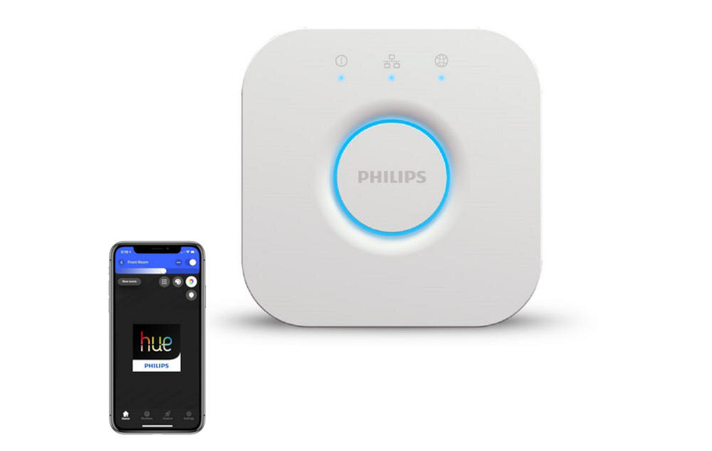 Na obrazie widoczna jest biała bramka z logo PHILIPS oraz niebieskim podświetleniem wokół centralnego przycisku. Obok znajduje się smartfon z aplikacją wyświetlającą logo hue PHILIPS.