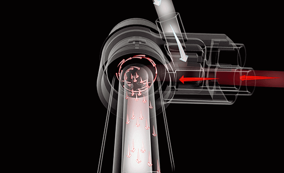 Grafika przedstawia schematyczny przekrój urządzenia z widocznymi strzałkami wskazującymi kierunek przepływu powietrza lub cieczy. Strzałki są koloru czerwonego i białego na czarnym tle.