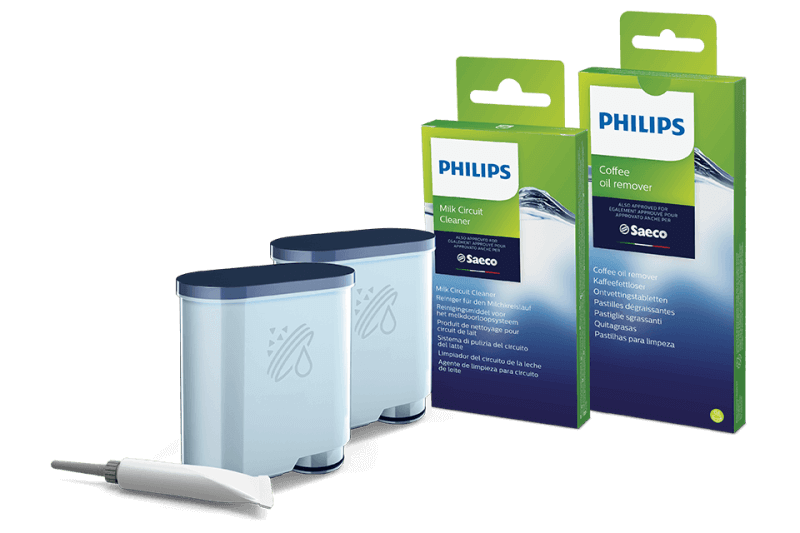 Na obrazie znajdują się dwa pojemniki z niebieskimi pokrywkami oraz dwa opakowania produktów czyszczących marki PHILIPS. Widoczny jest tekst: \'PHILIPS Milk Circuit Cleaner\' i \'PHILIPS Coffee oil remover\'.