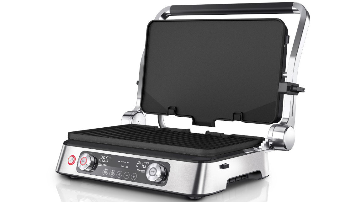 Na obrazie widoczny jest otwarty grill elektryczny z metaliczną obudową i czarnymi płytami grzewczymi. Na panelu sterowania znajdują się pokrętła, przyciski oraz wyświetlacz z temperaturą 265°C i 240°C.