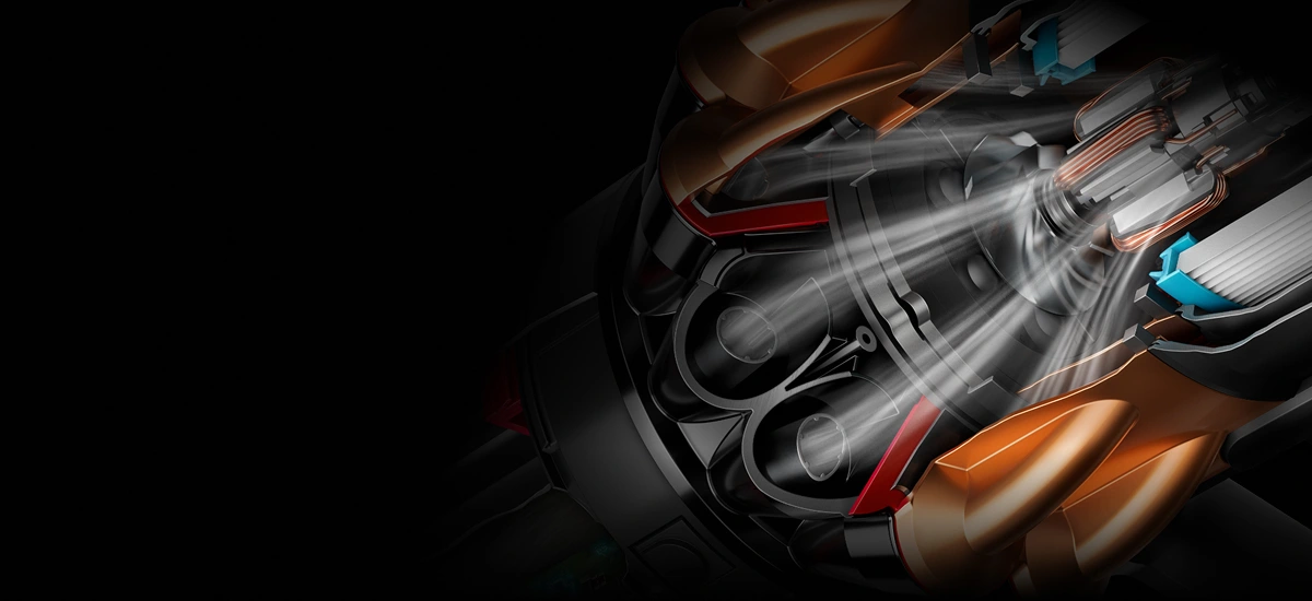 Obraz przedstawia zbliżenie na wnętrze urządzenia z widocznymi elementami mechanicznymi i przepływem powietrza. Kolory dominujące to czarny, złoty i czerwony.