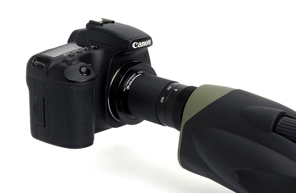 Aparat fotograficzny z logo Canon połączony z lunetą o ciemnym korpusie i zielonym wykończeniu. Na lunecie widoczny jest napis \'CELESTRON Ultima 80 52254\'.