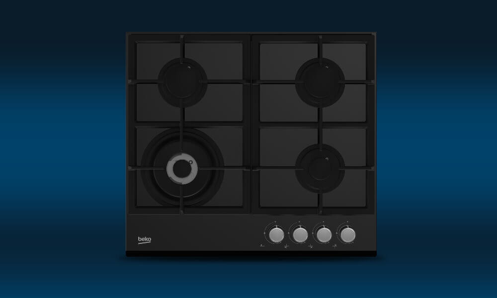Czarna płyta gazowa z czterema palnikami i czterema pokrętłami. Widoczne logo: beko.
