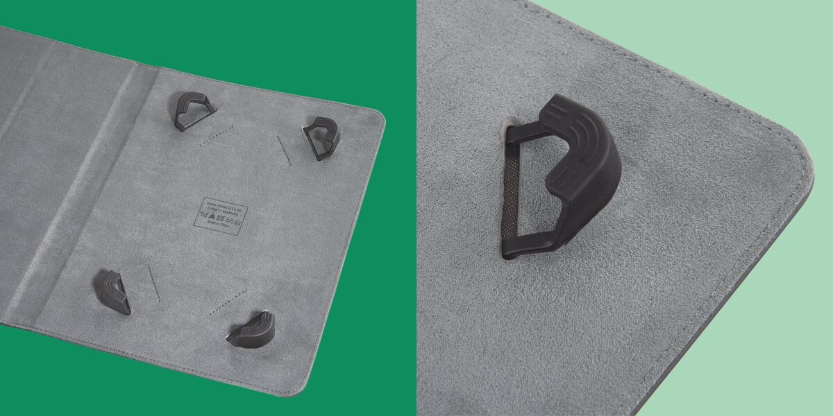 Etui w kolorze szarym z czterema czarnymi uchwytami w rogach. Widoczny jest zbliżenie na jeden z uchwytów oraz napis \'media expert\'.