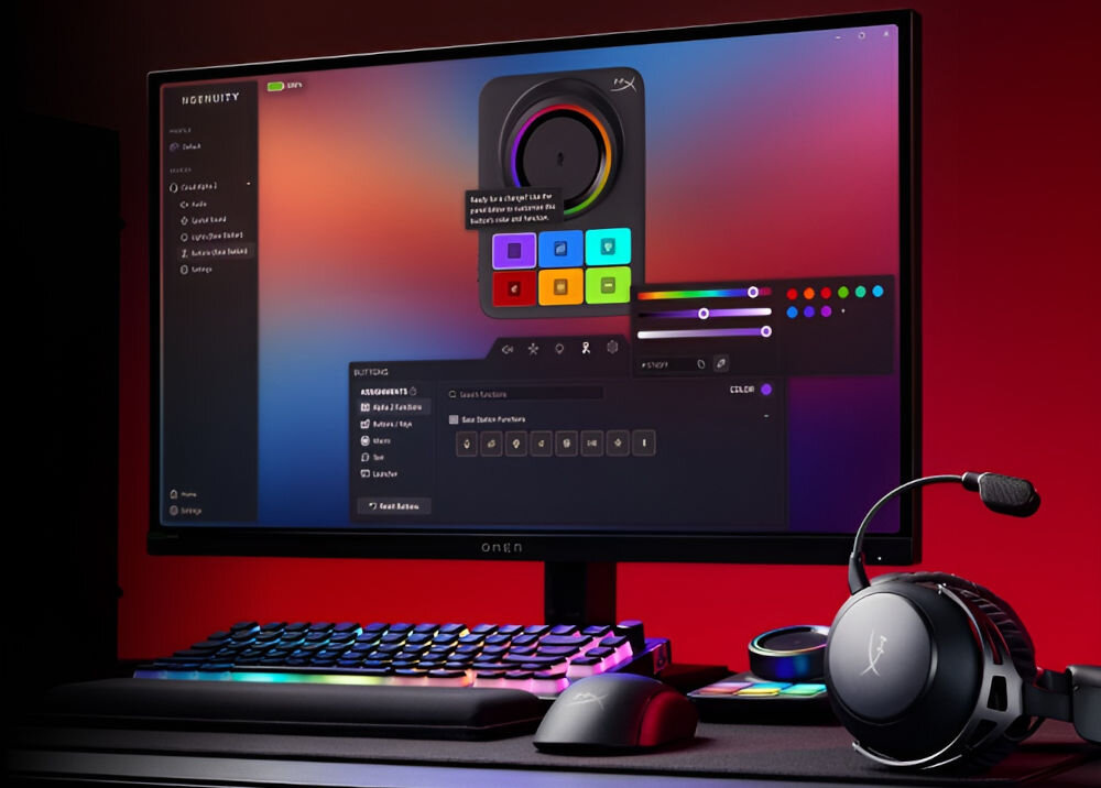 Na biurku znajduje się monitor z otwartym oprogramowaniem do zarządzania ustawieniami kolorów, klawiatura z podświetleniem RGB oraz słuchawki z mikrofonem. Na ekranie widoczny jest tekst: \'Ready to change? Use the wheel above to select the base color for section.\'