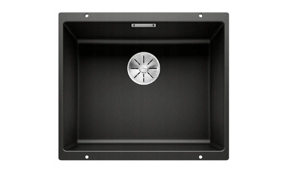 Czarny zlewozmywak jednokomorowy z okrągłym odpływem ze stali nierdzewnej na środku. Widać otwory montażowe na krawędziach.