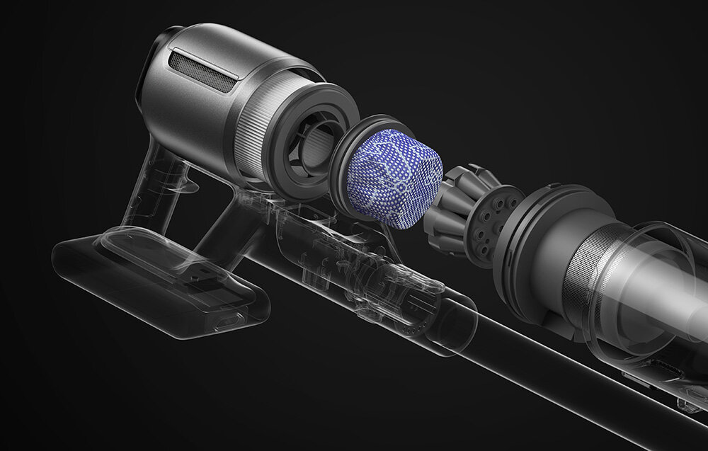 Zdjęcie przedstawia części wewnętrzne odkurzacza z widocznym filtrem i elementami konstrukcyjnymi. Na ciemnym tle widać szczegóły mechaniczne urządzenia.