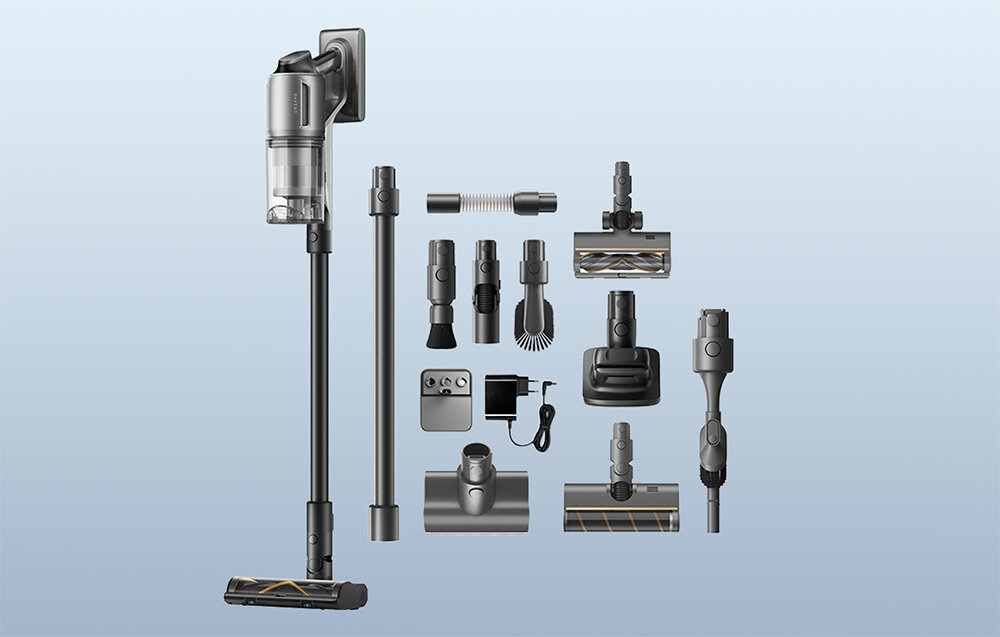 Zdjęcie przedstawia odkurzacz pionowy z różnymi akcesoriami, w tym szczotkami i rurkami. Widoczne jest logo \'Dreame\' na odkurzaczu.