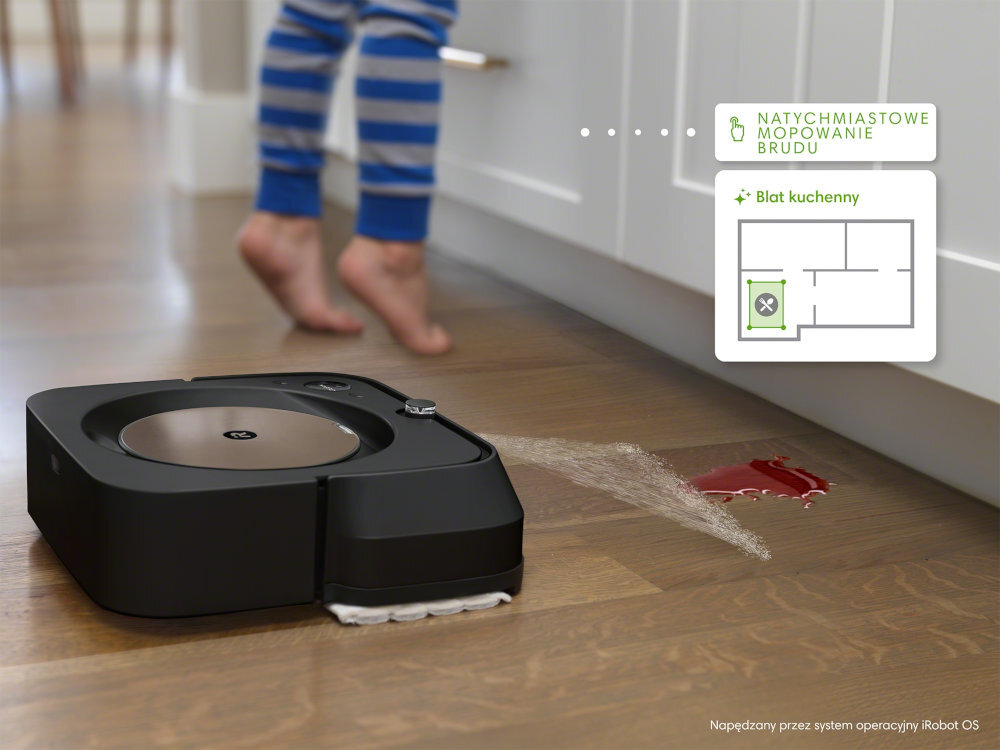 Robot sprzątający IROBOT Braava Jet M6 mopuje podłogę w kuchni, usuwając rozlany płyn. Na obrazie widoczny jest tekst: \'NATYCHMIASTOWE MOPOWANIE BRUDU\', \'Blat kuchenny\' oraz \'Napędzany przez system operacyjny iRobot OS\'.