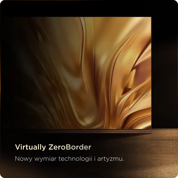 Front telewizora wyświetlający złotą, abstrakcyjną grafikę, ustawiony na jasnej powierzchni w ciemnym otoczeniu.