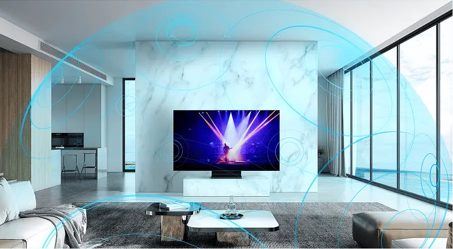 Telewizor TCL T69C w salonie z wizualizacją dźwięku przestrzennego Dolby Atmos wypełniającego pomieszczenie.