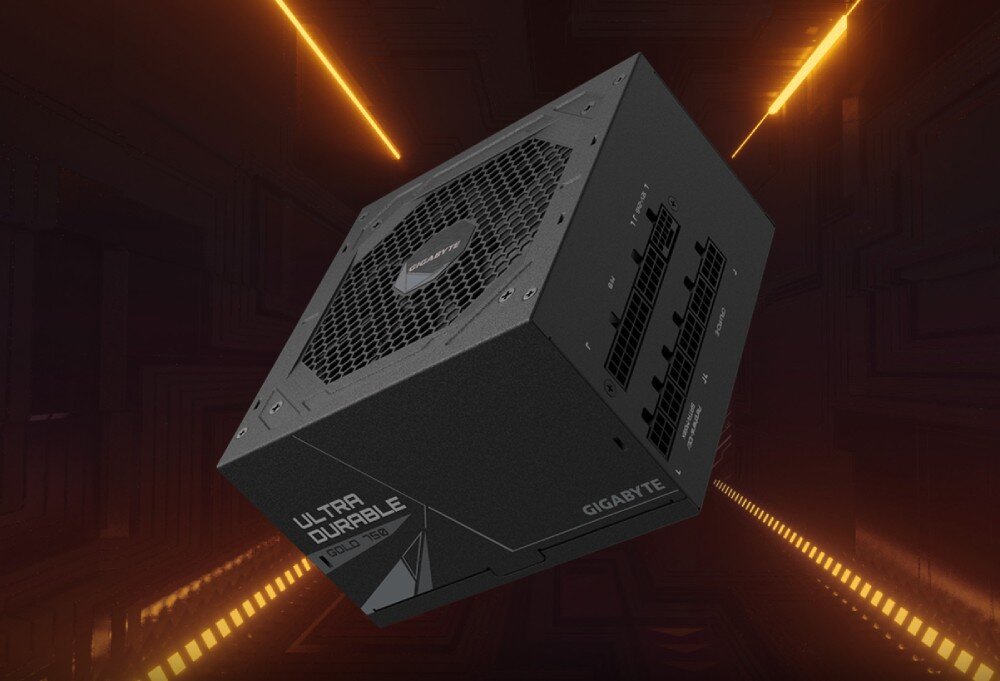 Na obrazie widoczny jest czarny zasilacz komputerowy z napisem \'ULTRA DURABLE\' i logo \'GIGABYTE\'. Tło jest ciemne z pomarańczowymi liniami świetlnymi.