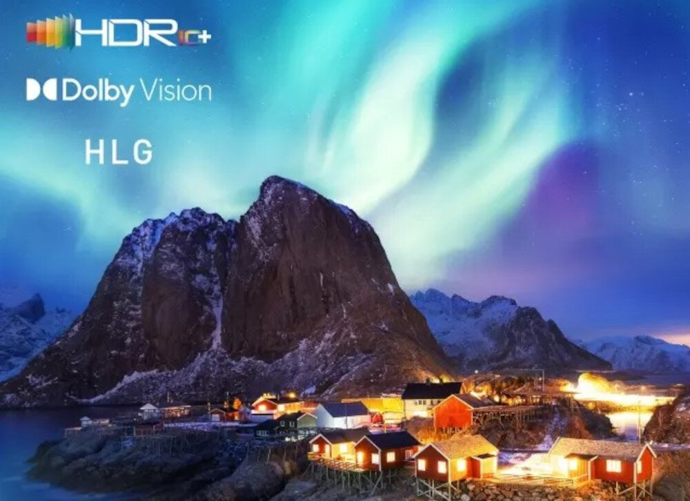 Obraz przedstawia malowniczy krajobraz z górami i zorzą polarną na niebie. Widoczne są napisy: HDR10+, Dolby Vision, HLG.