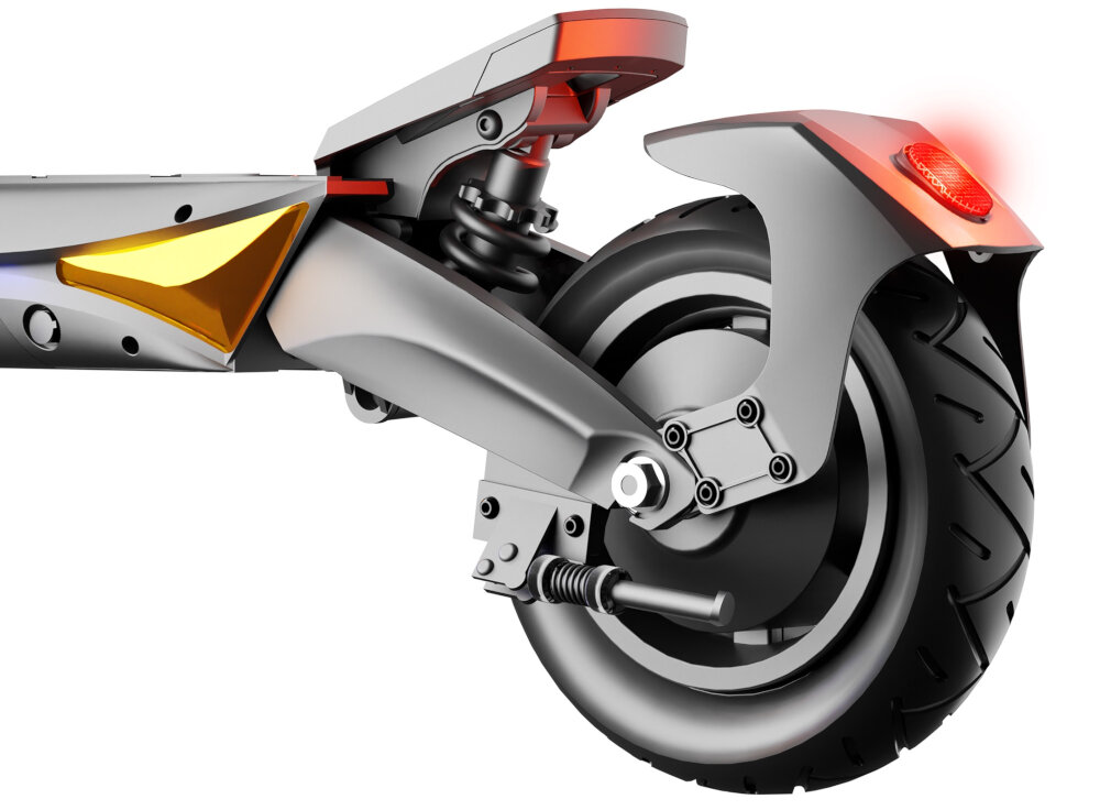 Obraz przedstawia tylne koło hulajnogi elektrycznej z amortyzacją i czerwonym światłem tylnym. Widoczny jest również element zawieszenia oraz metalowa konstrukcja ramy.