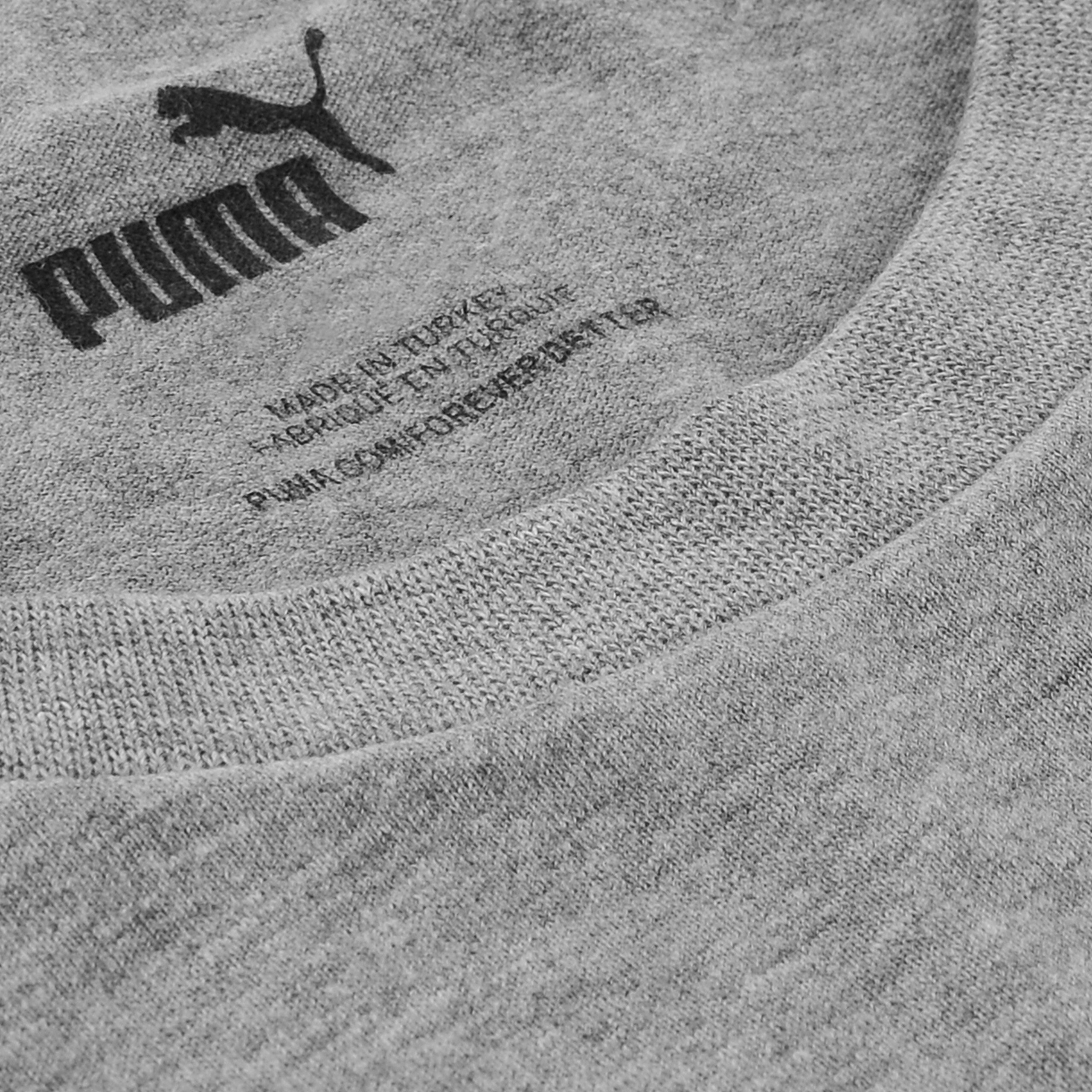 Szara koszulka z widocznym logo \'PUMA\' oraz napisem \'MADE IN TURKEY\' i adresem \'PUMA.COM/FOREVERBETTER\'.