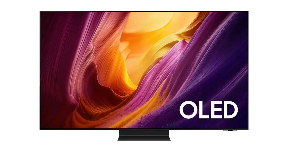 Telewizor z wyświetlaczem OLED pokazujący abstrakcyjny, kolorowy wzór w odcieniach fioletu, pomarańczu i żółci. Na ekranie widoczny jest napis \'OLED\'.