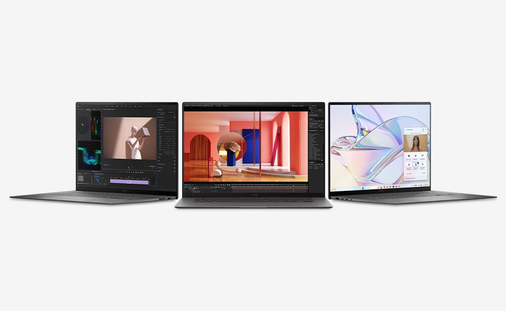 Trzy laptopy z otwartymi ekranami, na których wyświetlane są różne aplikacje i grafiki. Każdy z laptopów ma cienkie ramki wokół ekranu.
