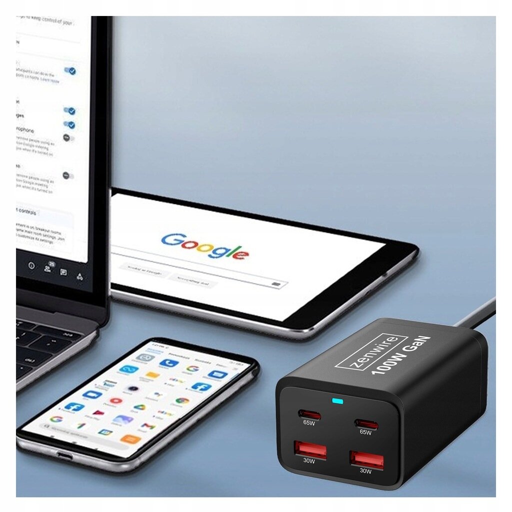 Na obrazie widoczna jest czarna ładowarka z napisem \'Zenwire 100W GaN\' oraz czterema portami USB, z których dwa oznaczone są jako 65W, a dwa jako 30W. W tle znajdują się laptop, tablet z otwartą stroną Google i smartfon z ikonami aplikacji.