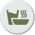 Ikona przedstawia zielony symbol parującej miski na białym tle.