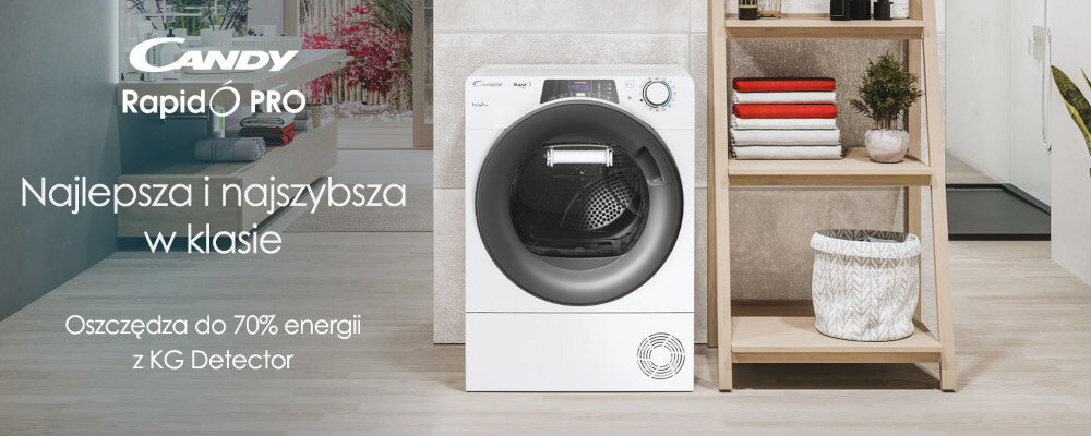 Na obrazie znajduje się suszarka marki Candy z serii RapidO Pro, ustawiona obok drewnianego regału z ręcznikami i rośliną. Na obrazie widoczny jest tekst: \'Najlepsza i najszybsza w klasie. Oszczędza do 70% energii z KG Detector\'.