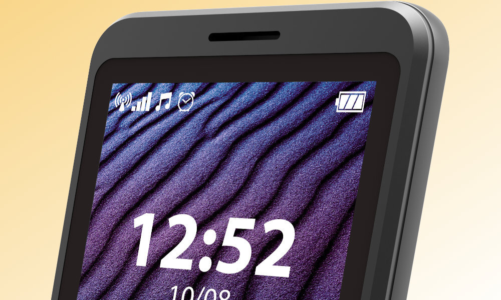 Zbliżenie na ekran telefonu z wyświetloną godziną 12:52 i datą 10/08. W górnej części ekranu widoczne są ikony sygnału, muzyki, alarmu i poziomu baterii.