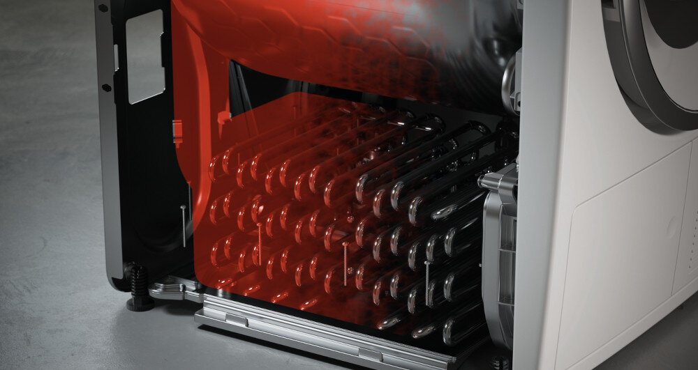 Wnętrze urządzenia z widocznymi elementami grzewczymi i obudową. Część obudowy jest przezroczysta, ukazując czerwone elementy wewnętrzne.