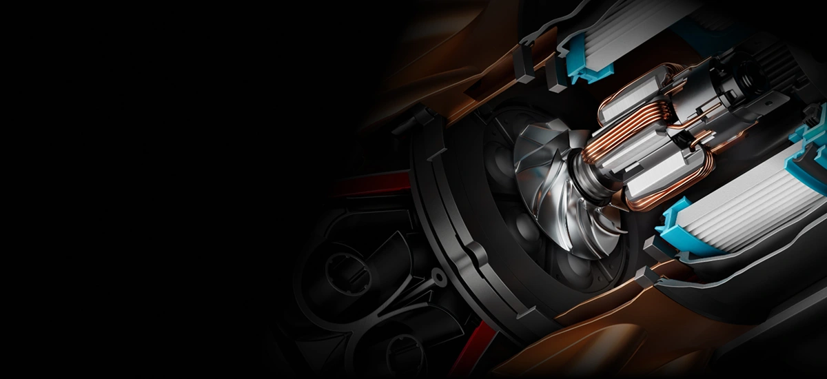 Obraz przedstawia szczegółowy widok wnętrza urządzenia z widocznymi elementami mechanicznymi i przewodami miedzianymi. Po lewej stronie obraz jest zaciemniony, co podkreśla centralny element konstrukcji.