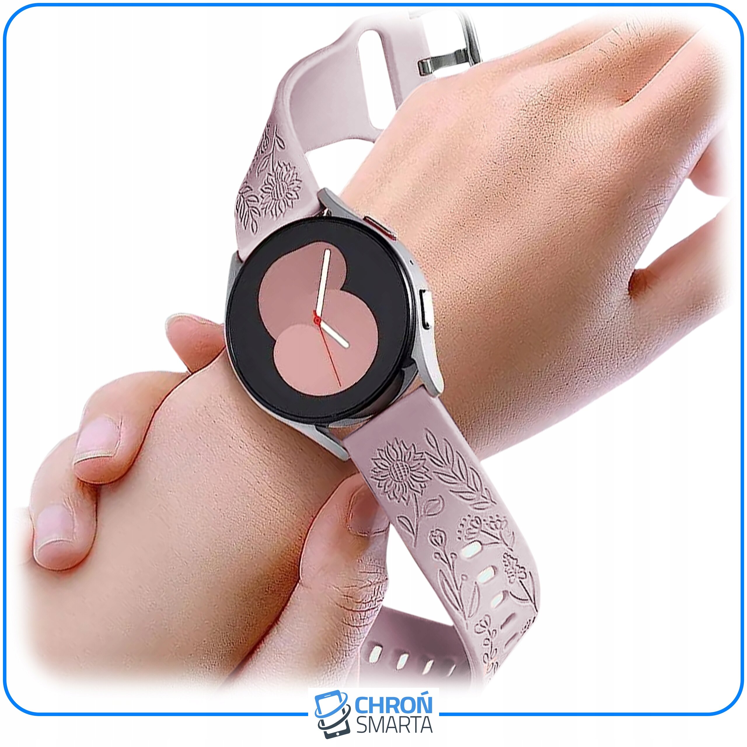 Na zdjęciu widoczny jest smartwatch na nadgarstku z różowym paskiem ozdobionym wzorem kwiatowym. W dolnej części obrazu znajduje się logo \'CHROŃ SMARTA\'.