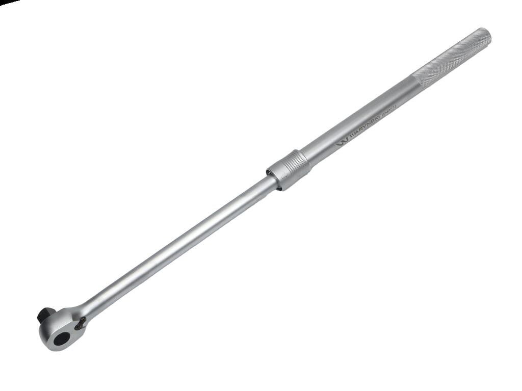 Na obrazie widoczna jest metalowa grzechotka teleskopowa z napisem \'Waryński\' na rękojeści. Narzędzie ma srebrny kolor i posiada mechanizm zębatkowy na jednym końcu.