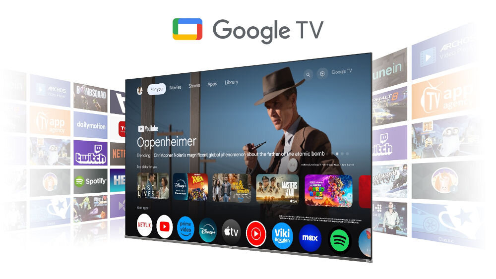 Obraz przedstawia ekran telewizora z interfejsem Google TV, na którym widoczne są różne aplikacje, takie jak YouTube, Netflix, Prime Video, Disney+, Apple TV i inne. W tle widoczny jest fragment filmu z postacią w kapeluszu, a na górze ekranu znajduje się logo Google TV.