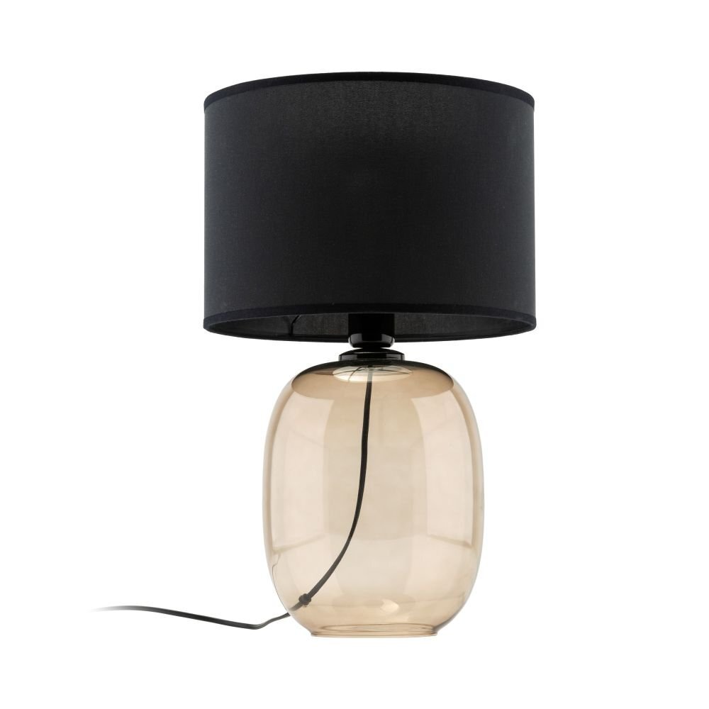 Lampa stołowa z czarnym abażurem i przezroczystą, szklaną podstawą w kształcie owalnym. Przewód zasilający widoczny jest wewnątrz podstawy.