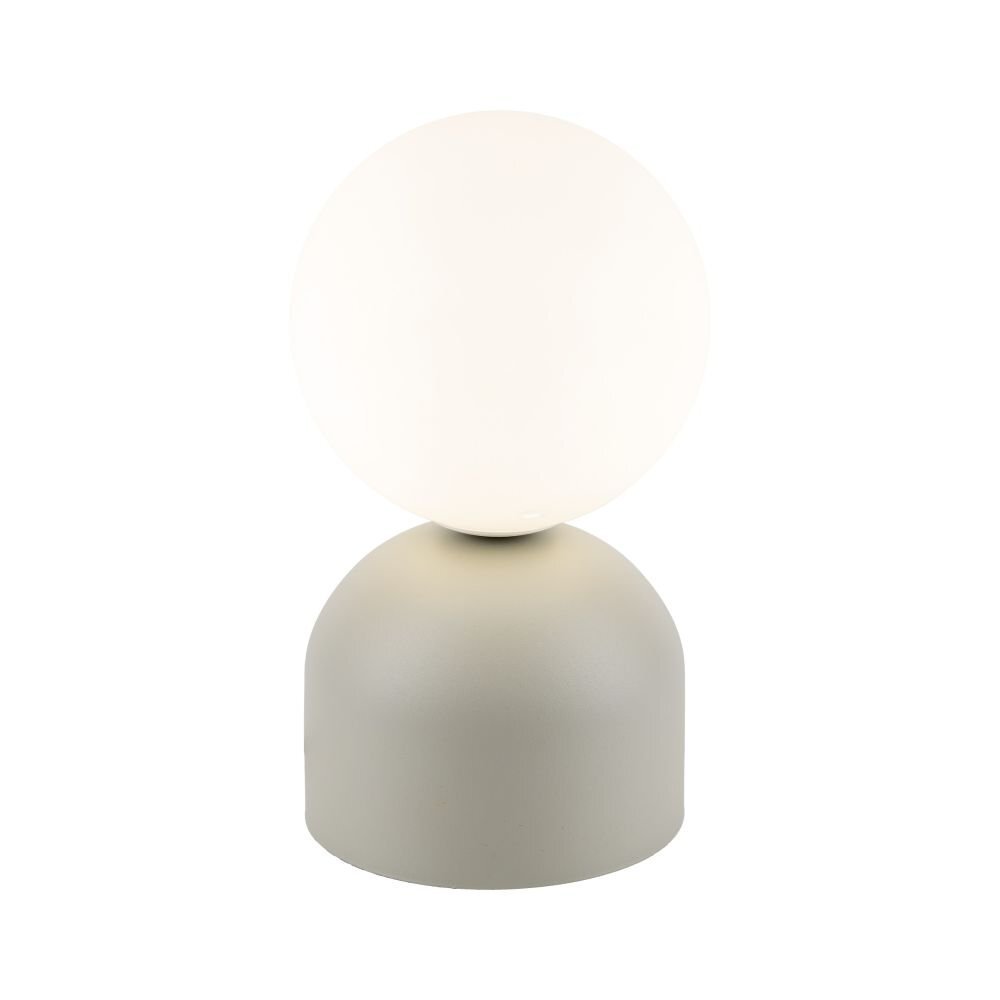 Na obrazie widoczna jest lampa stołowa z kulistym, białym kloszem na beżowej podstawie. Lampa ma nowoczesny design i jest przeznaczona do pokoju dziecięcego.