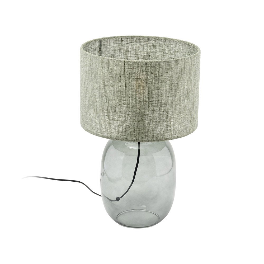 Lampa stołowa z przezroczystą, szklaną podstawą i cylindrycznym abażurem w kolorze grafitowo-zielonym. Kabel zasilający jest widoczny wewnątrz podstawy.