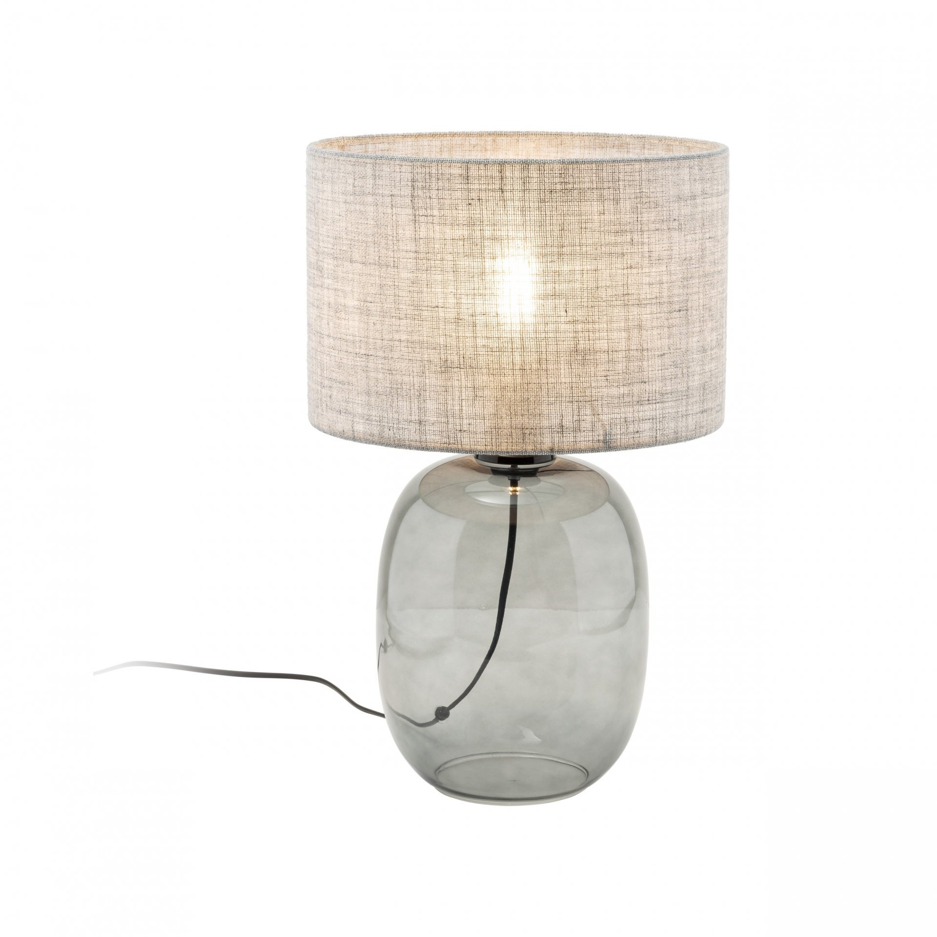 Na obrazie widoczna jest nowoczesna lampa stołowa z przezroczystą, grafitową podstawą i jasnym abażurem. Lampa ma podłączony czarny przewód zasilający.