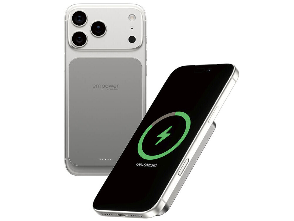 Na obrazie widoczny jest smartfon z podłączonym powerbankiem, na ekranie którego wyświetla się ikona ładowania z napisem \'85% Charged\'. Powerbank ma napis \'empower\' i jest w kolorze tytanowym.